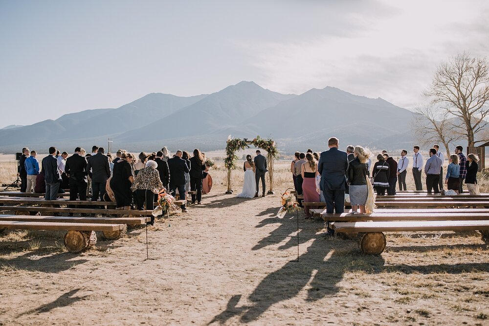 wedding ceremony, bride and groom at the alter, the barn at sunset ranch in buena vista co, buena vista colorado wedding, the barn at sunset ranch wedding, buena vista colorado wood barn wedding venue