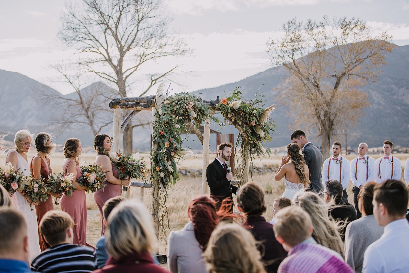 wedding ceremony, bride and groom at the alter, the barn at sunset ranch in buena vista co, buena vista colorado wedding, the barn at sunset ranch wedding, buena vista colorado wood barn wedding venue