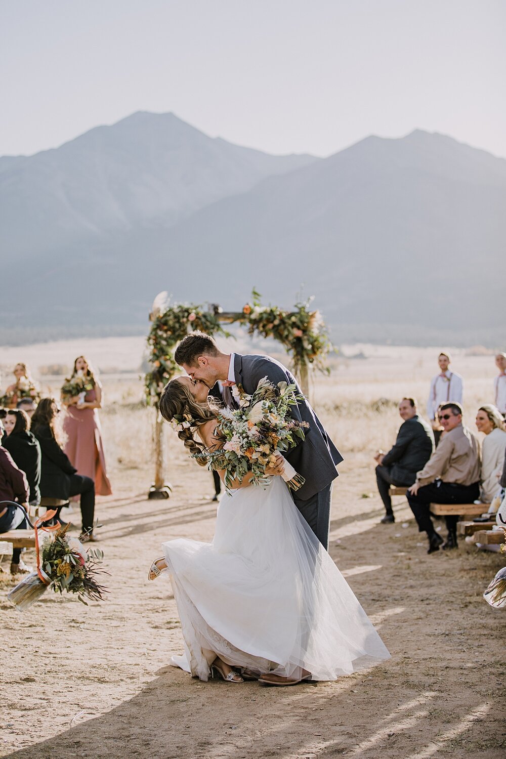 wedding ceremony kiss, bride and groom personal vows, the barn at sunset ranch in buena vista co, buena vista colorado wedding, the barn at sunset ranch wedding, buena vista colorado wedding venue