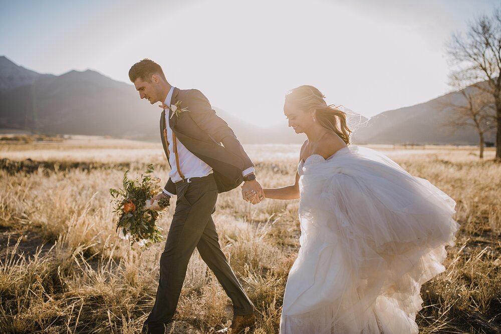 bride and groom hiking, wedding reception, the barn at sunset ranch in buena vista co, buena vista colorado wedding, the barn at sunset ranch wedding, buena vista colorado mountain wedding venue