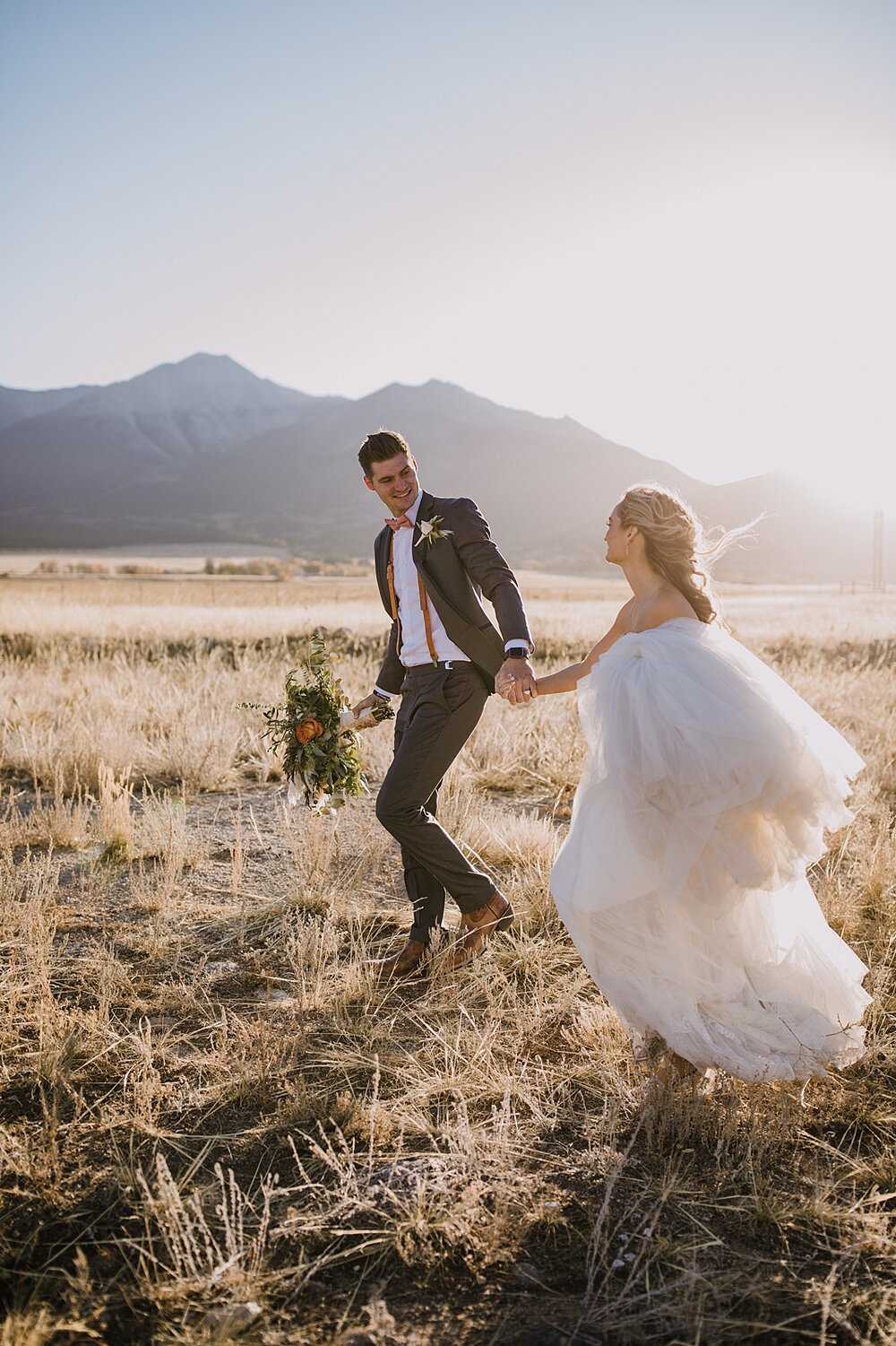 bride and groom hiking, wedding reception, the barn at sunset ranch in buena vista co, buena vista colorado wedding, the barn at sunset ranch wedding, buena vista colorado wood barn wedding venue