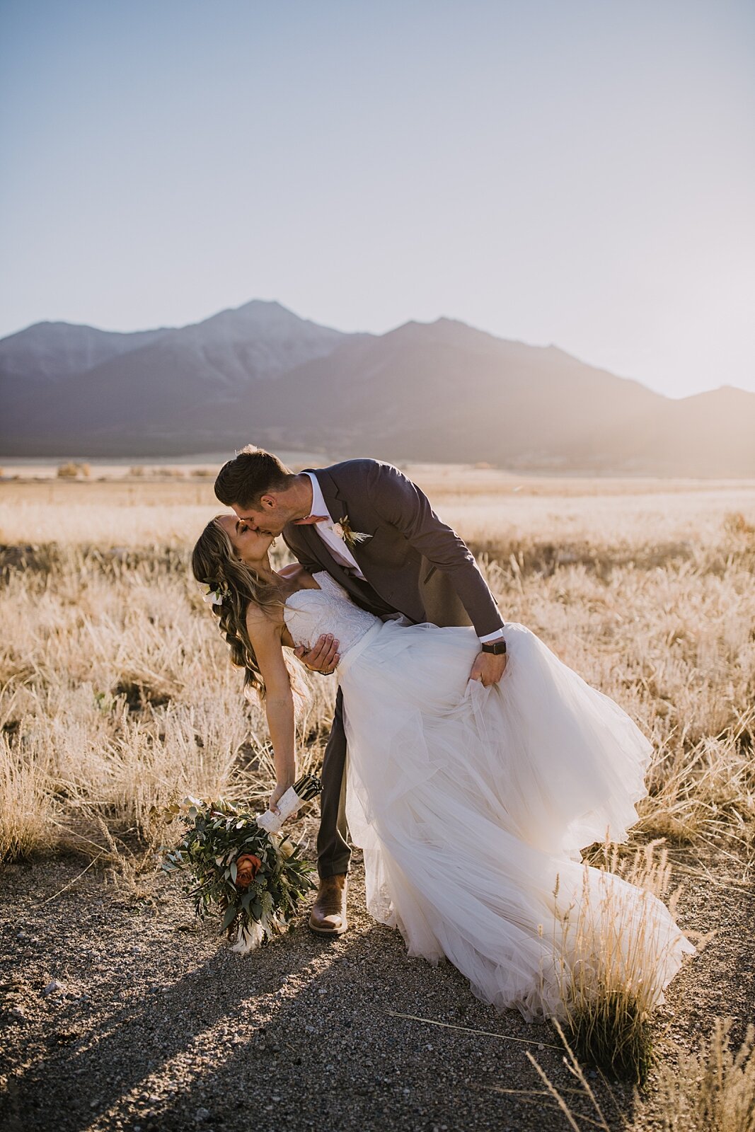 groom dipping the bride, wedding reception, the barn at sunset ranch in buena vista co, buena vista colorado wedding, the barn at sunset ranch wedding, buena vista colorado rustic barn wedding venue