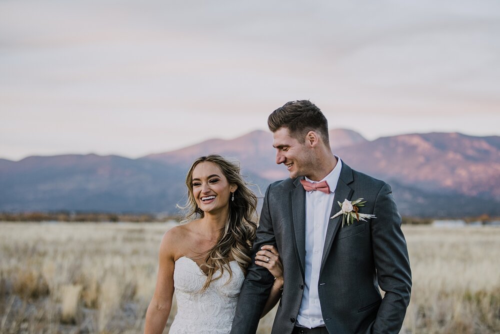 bride and groom walking, alpine glow on mt princeton, the barn at sunset ranch in buena vista co, buena vista colorado wedding, the barn at sunset ranch wedding, buena vista colorado wedding venue