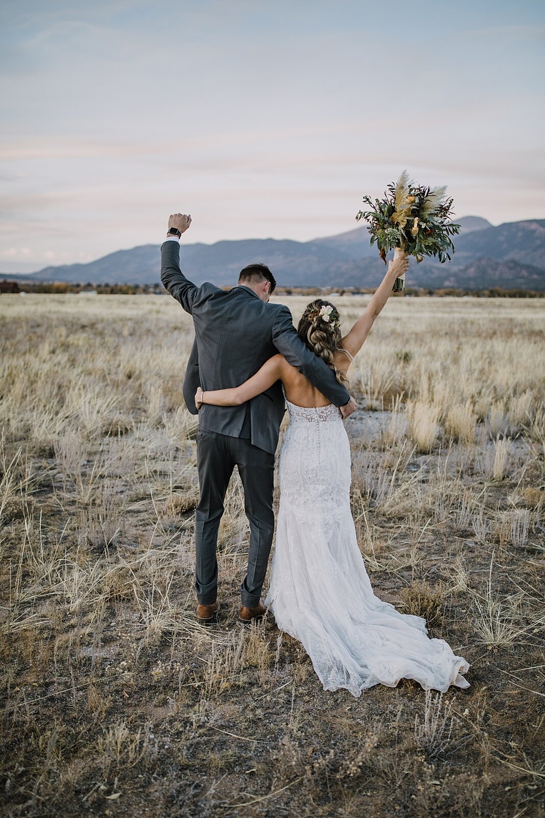bride and groom celebrating, alpine glow on mt princeton, the barn at sunset ranch in buena vista co, buena vista colorado wedding, the barn at sunset ranch wedding, buena vista colorado wedding venue