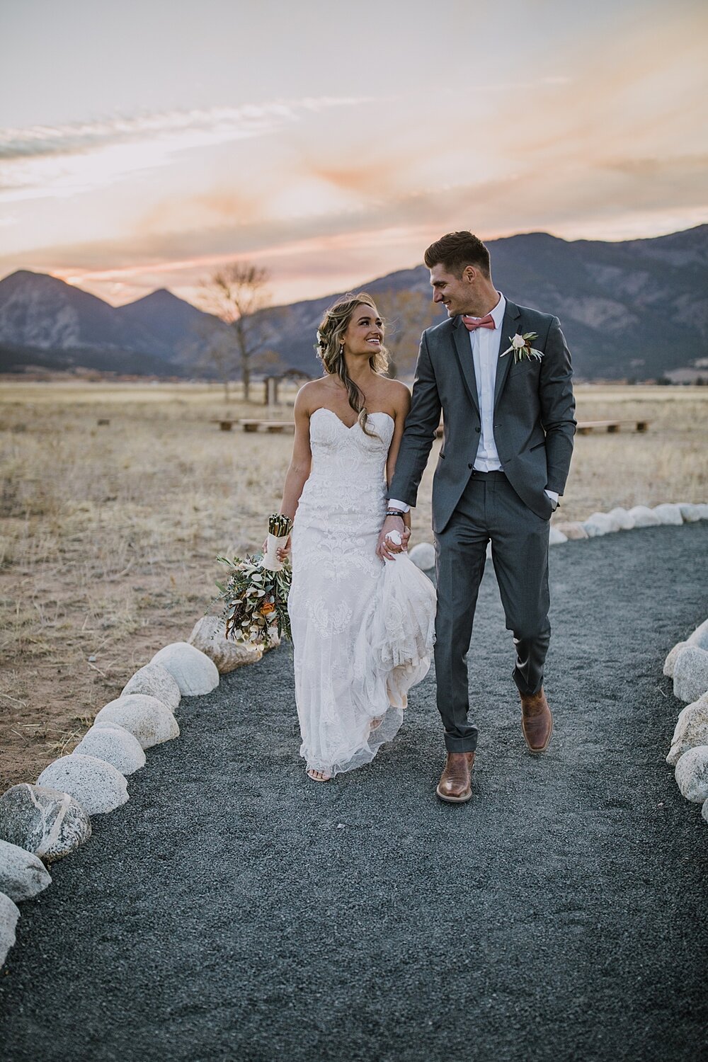 bride and groom walking at sunset, mt princeton wedding, the barn at sunset ranch in buena vista co, buena vista colorado wedding, the barn at sunset ranch wedding, buena vista colorado wedding venue