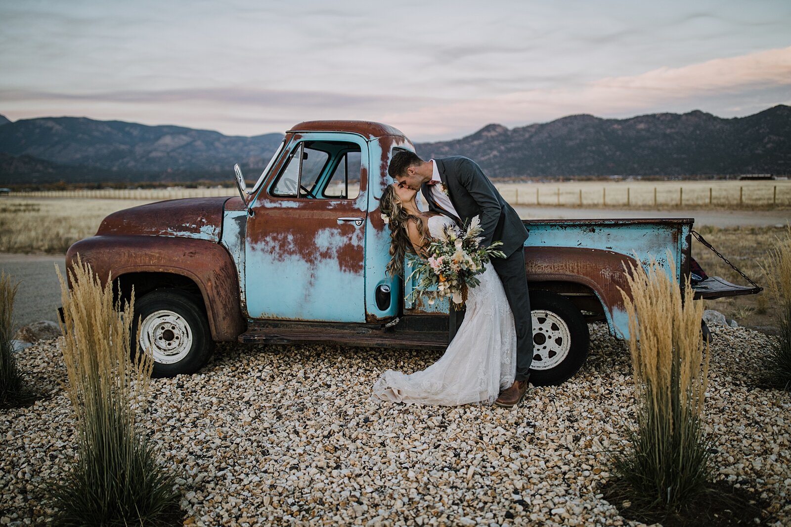 bride and groom with patina old ford truck, the barn at sunset ranch in buena vista co, buena vista colorado wedding, the barn at sunset ranch wedding, buena vista colorado wedding venue