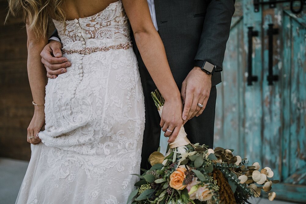 bride and groom in front of barn doors, the barn at sunset ranch in buena vista co, buena vista colorado wedding, the barn at sunset ranch wedding, buena vista colorado wood barn rustic wedding venue