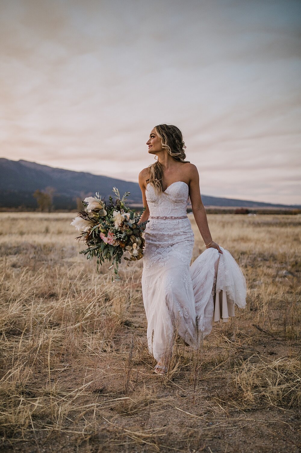 bride with flower bouquet, alpine glow on mt princeton, the barn at sunset ranch in buena vista co, buena vista colorado wedding, the barn at sunset ranch wedding, buena vista colorado wedding venue