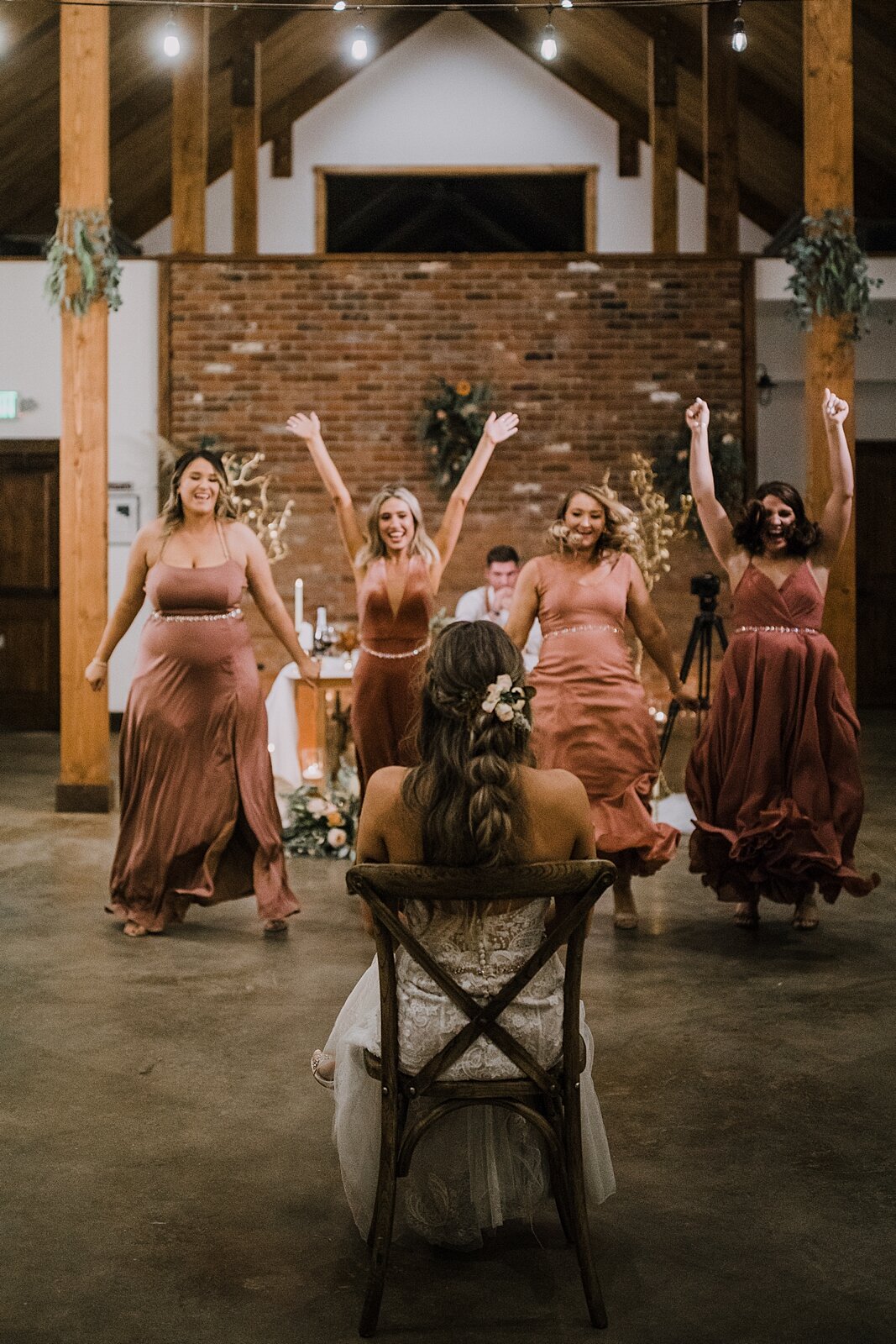 bridesmaids song and dance routine to the bride, the barn at sunset ranch in buena vista co, buena vista colorado wedding, the barn at sunset ranch wedding, buena vista colorado barn wedding venue