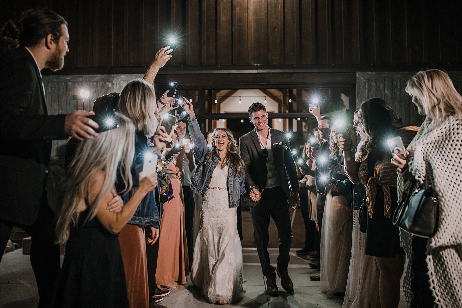 faux sparkler phone light bride and groom send off, the barn at sunset ranch in buena vista co, buena vista colorado wedding, the barn at sunset ranch wedding, buena vista colorado barn wedding venue