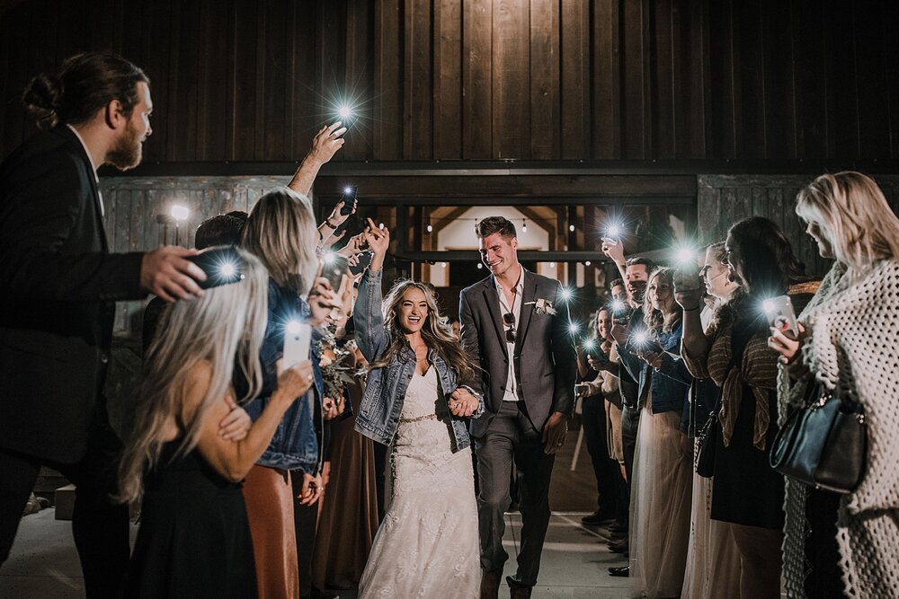 faux sparkler phone light bride and groom send off, the barn at sunset ranch in buena vista co, buena vista colorado wedding, the barn at sunset ranch wedding, buena vista colorado barn wedding venue