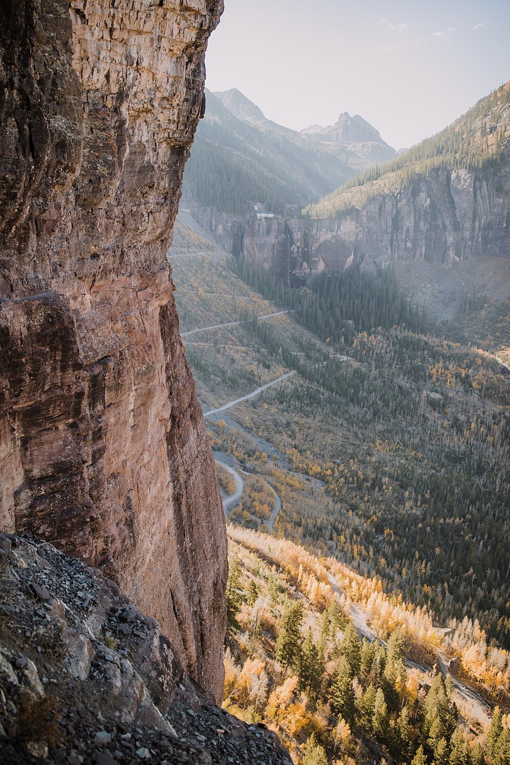 telluride colorado's via ferrata main event, telluride valley elopement, black bear pass summit road, bridal veil falls in autumn, bridal veil falls historic power station