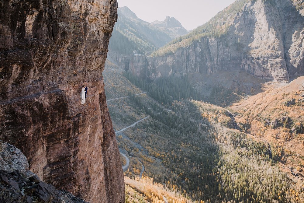 bride and groom on telluride via ferrata main event, bride and groom climbing, telluride via ferrata climbing elopement, via ferrata climbing elopement, rock climbing elopement