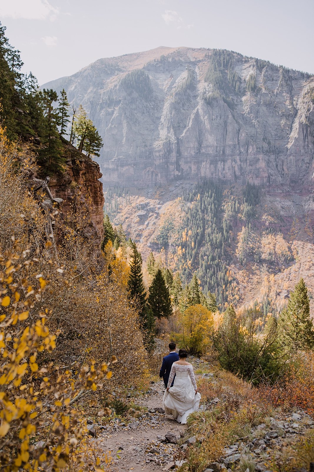 bride and groom hiking out of the telluride via ferrata, telluride via ferrata elopement, telluride overlook, black bear pass overlook, black bear pass elopement, black bear pass 4x4 ohv road