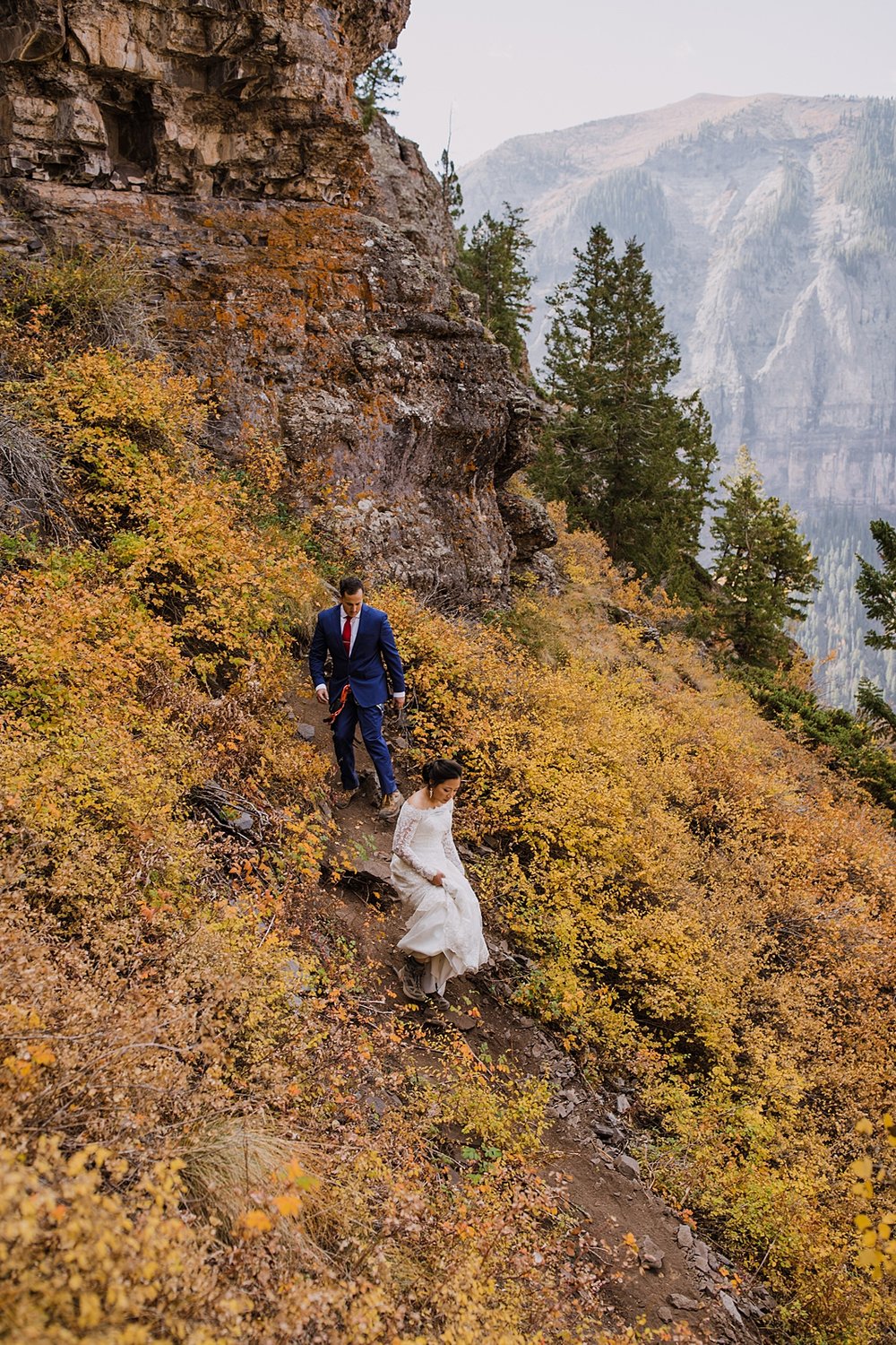 bride and groom hiking out of the telluride via ferrata, telluride via ferrata elopement, telluride overlook, black bear pass overlook, black bear pass elopement, black bear pass 4x4 ohv road