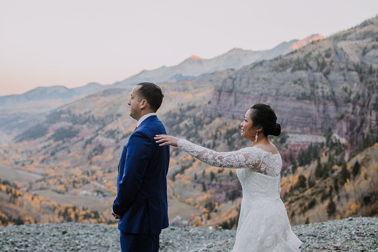 bride and groom first look, bride and groom on a cliff edge, cliffside elopement, mountain climbing elopement, colorado climbing elopement, southern colorado elopement
