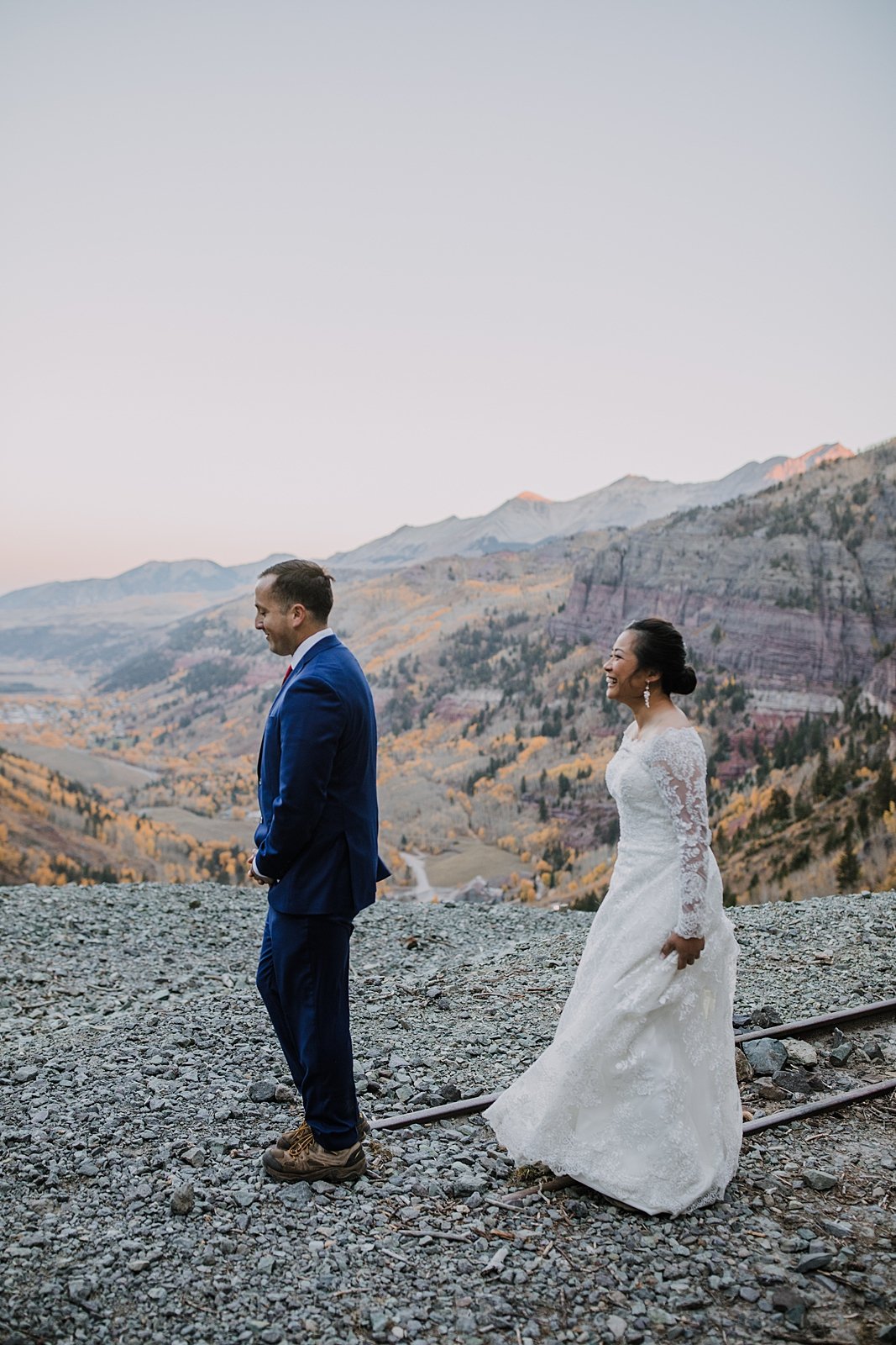bride and groom first look, bride and groom on a cliff edge, cliffside elopement, mountain climbing elopement, colorado climbing elopement, southern colorado elopement