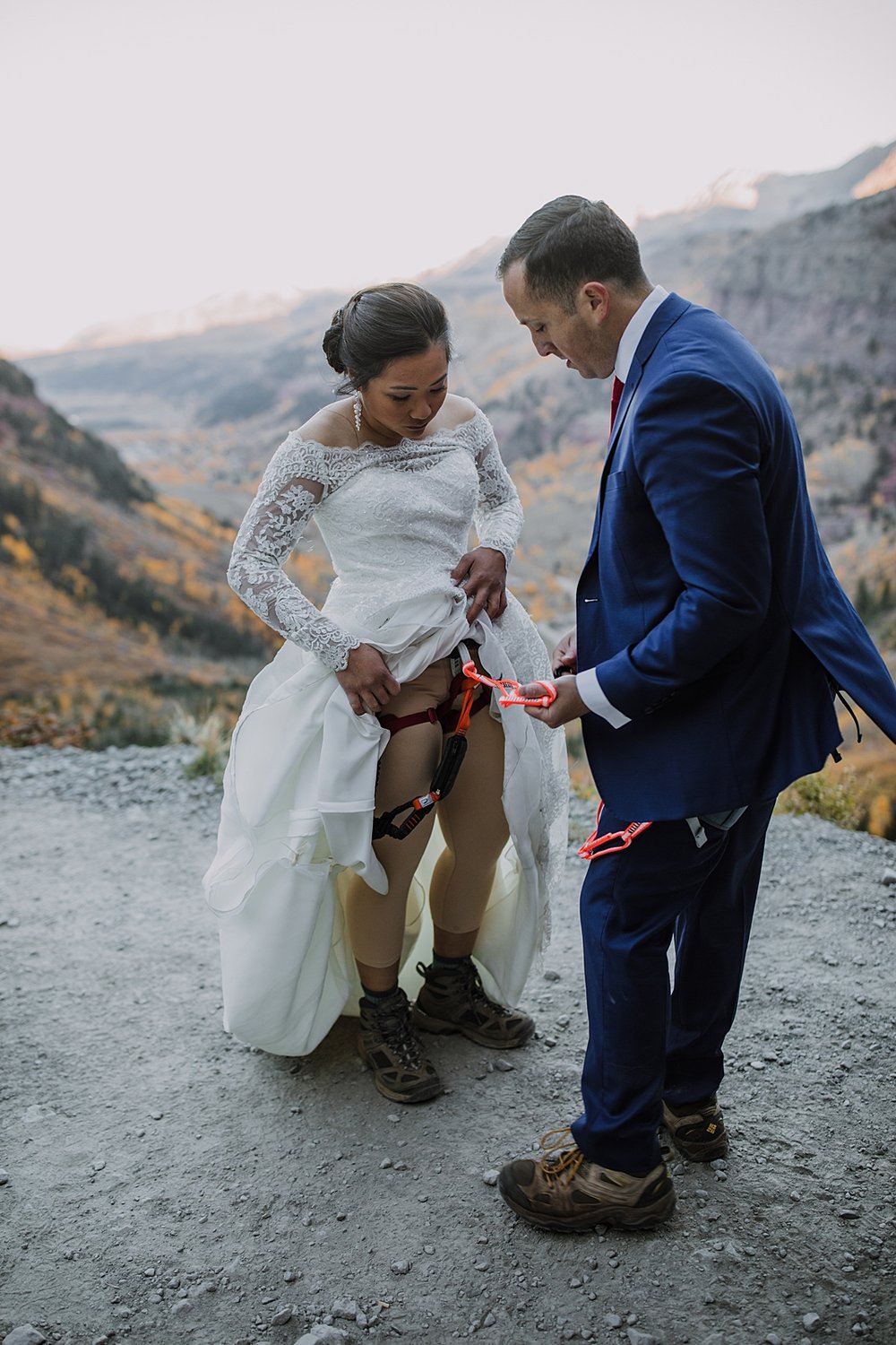 bride and groom climbing harnesses, telluride via ferrata climbing elopement, via ferrata climbing elopement, rock climbing wedding, elopement day ideas