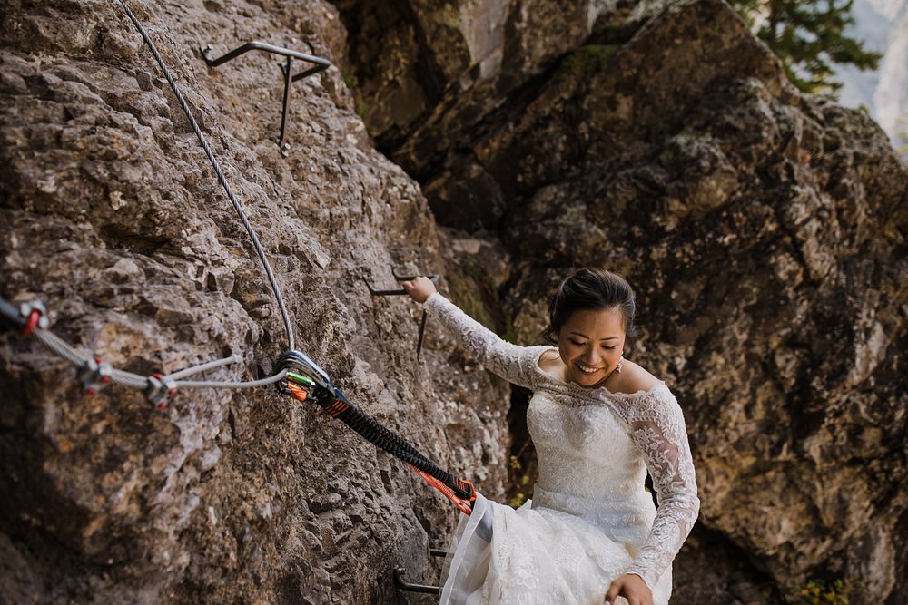 adventurous climbing bride on elopement day, hiking the telluride via ferrata, eloping in telluride valley, telluride mountain elopement, telluride wedding, telluride colorado hiking 