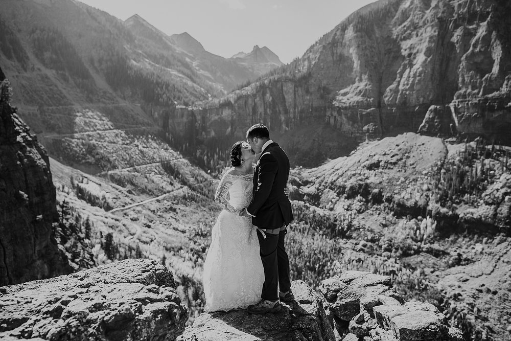 bride and groom standing on the telluride via ferrata, telluride via ferrata elopement, telluride overlook, black bear pass overlook, black bear pass elopement, black bear pass 4x4 ohv road