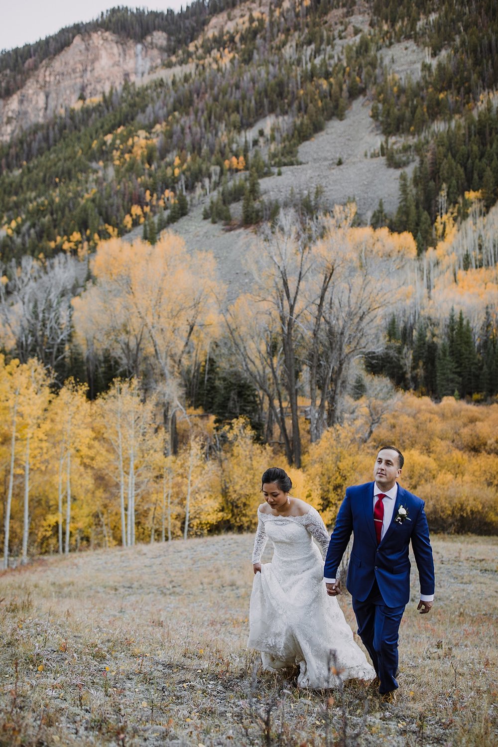 bride and groom hiking, telluride mountain elopement, telluride colorado elopement, trout lake elopement, hope lake elopement, fall mountain elopement