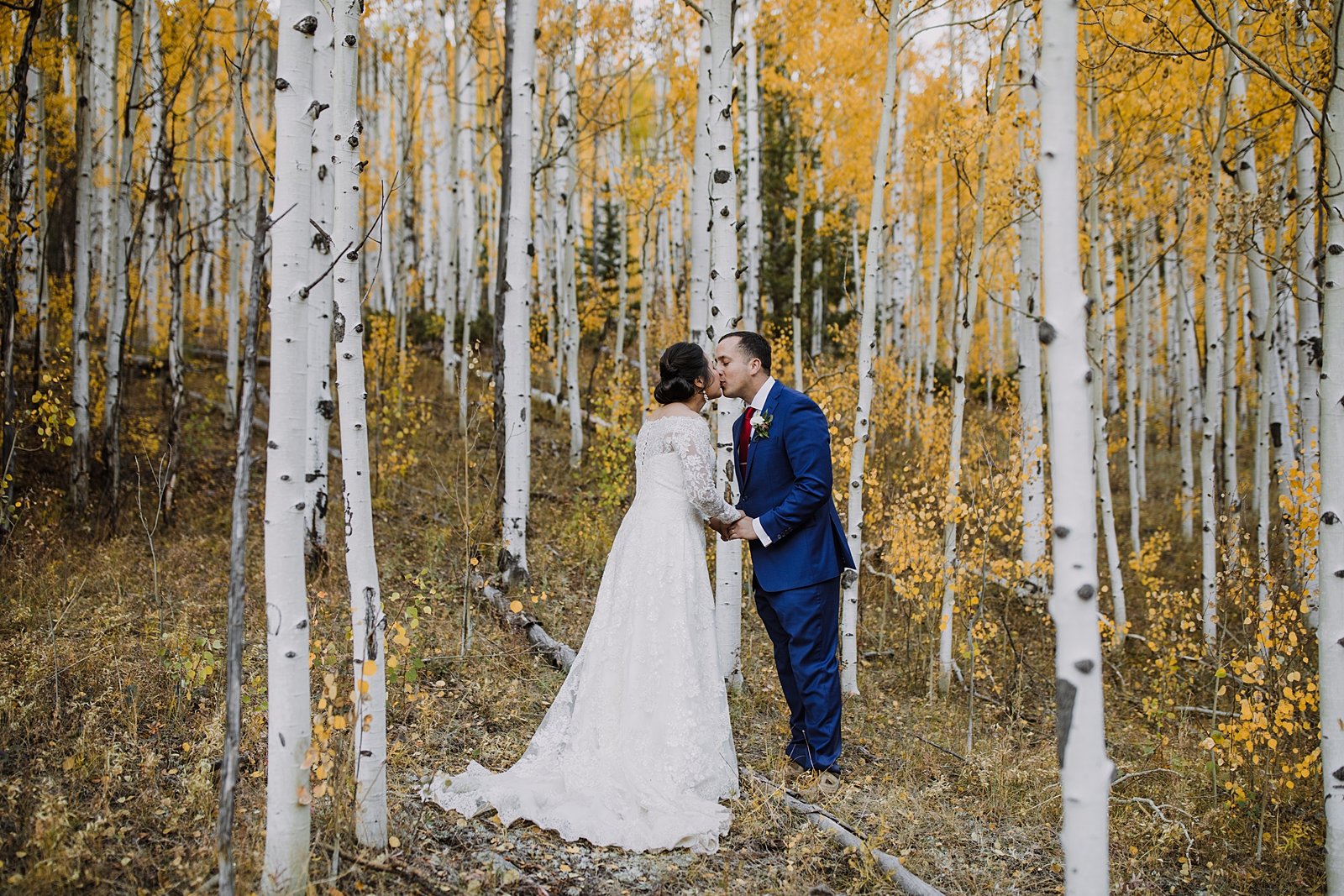 bride and groom kissing, fall mountain elopement ceremony, aspen grove elopement ceremony, telluride elopement ceremony, colorado mountain ceremony