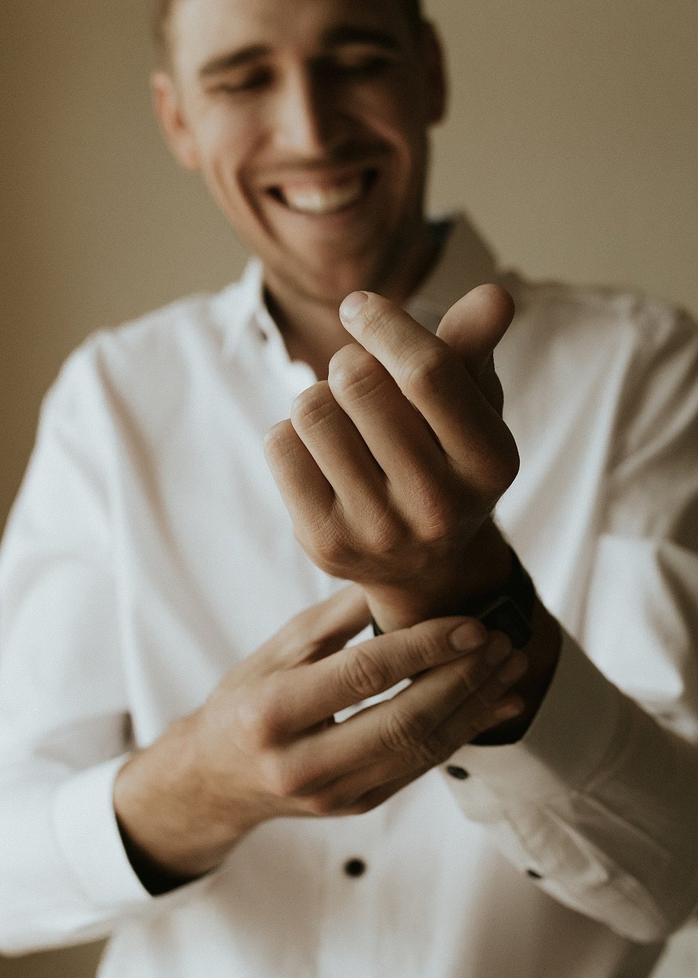 groom getting ready, groom buttoning cuff links, studio 508, city on a hill coffee, leadville elopement, leadville colorado elopement, leadville mining elopement