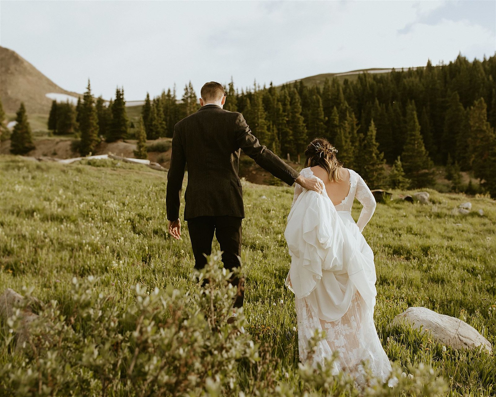 elopement first look, bride and groom hiking, mountain hiking elopement, mayflower gulch elopement, colorado wildflowers, mayflower gulch mining cabins, leadville colorado elopement