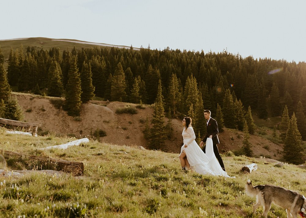 bride and groom hiking, mountain hiking elopement, mayflower gulch elopement, colorado wildflower elopement, mayflower gulch elopement, leadville colorado elopement, western mountain elopement