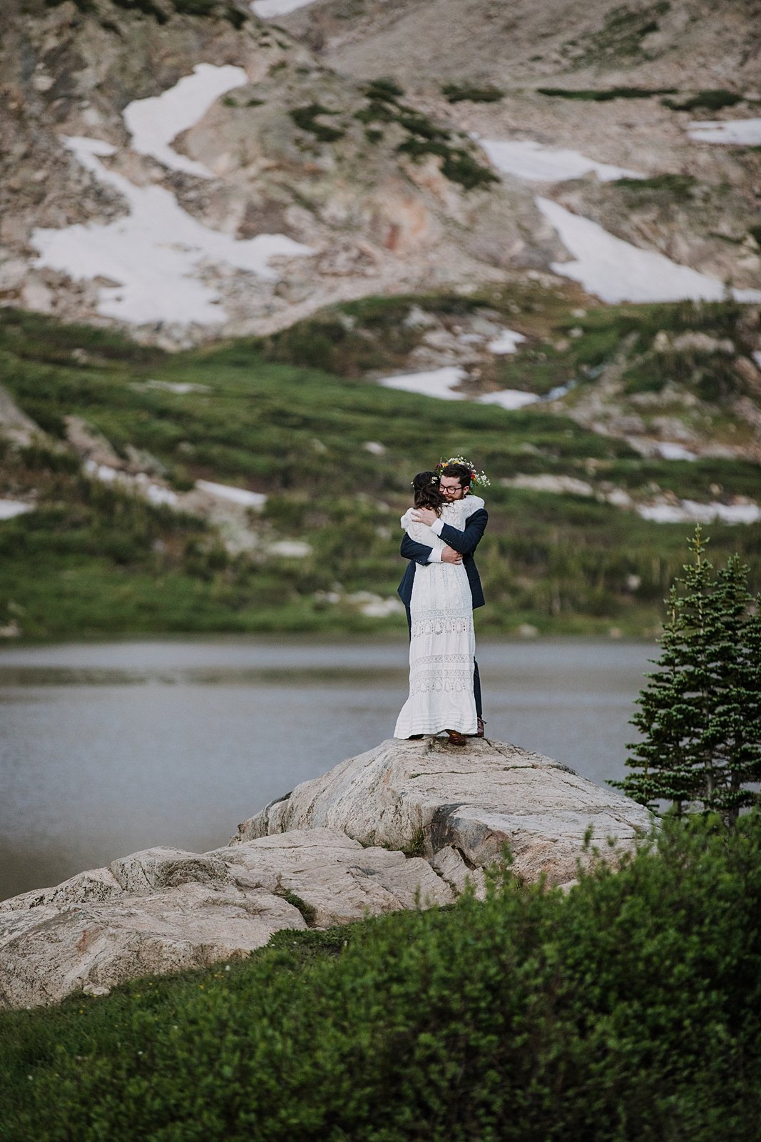 bride and groom hugging, hiking elopement first look, indian peaks wilderness, elopement at lake isabelle, backcountry trekking elopement, glacier valley elopement