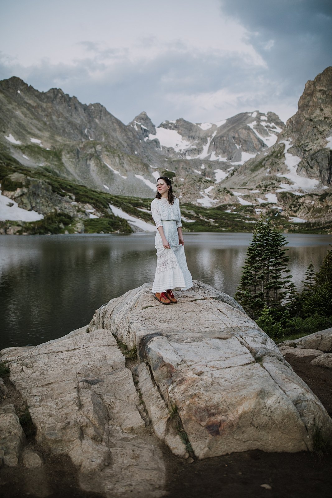 bride in dress on lakeshore, summer morning elopement, rocky mountain national park elopement, hiking the continental divide, colorado rockies elopement, glacier lake elopement