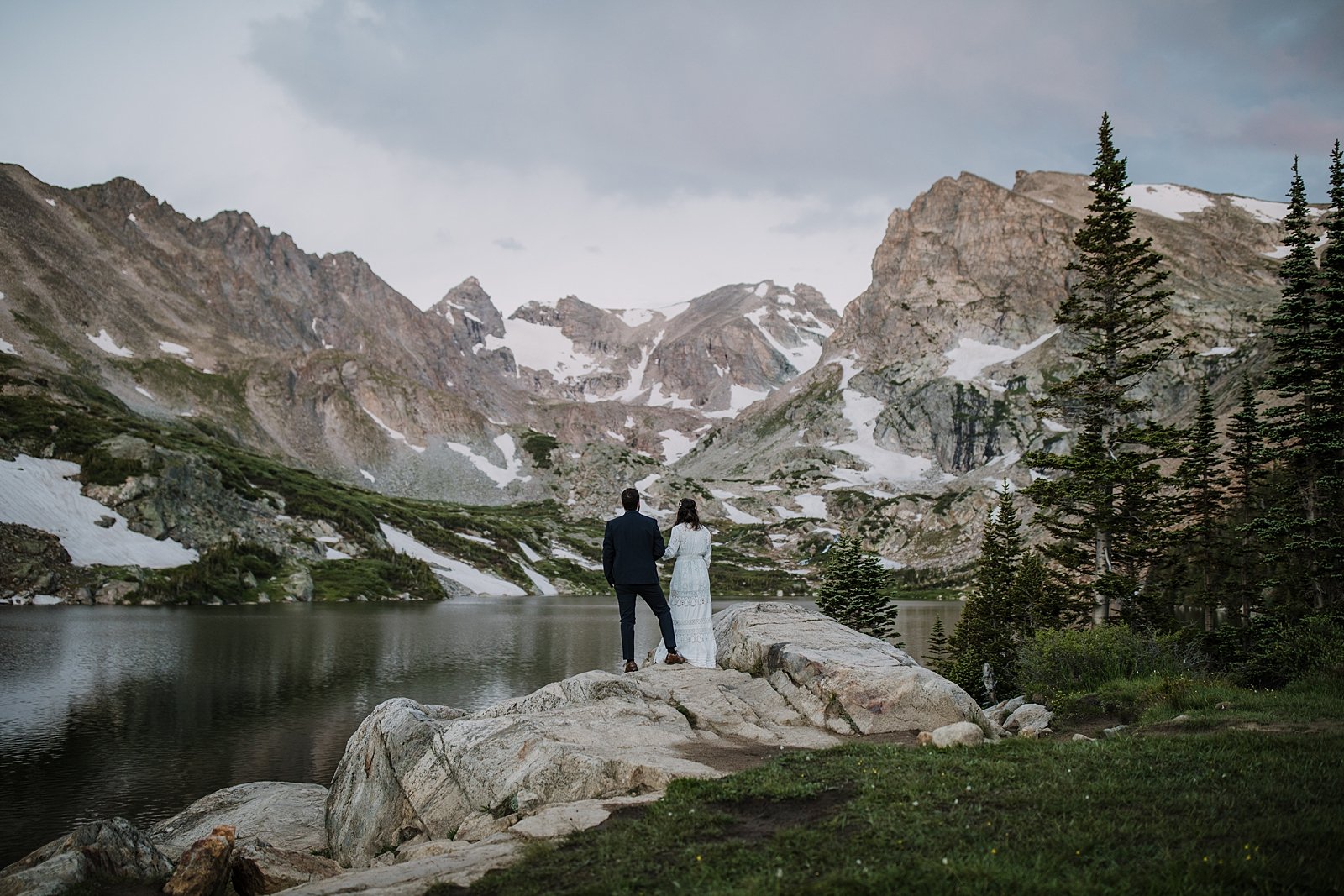 bride and groom hiking, lake shore elopement ceremony, ward colorado elopement, estes park elopement, nederland elopement, alpine lake elopement