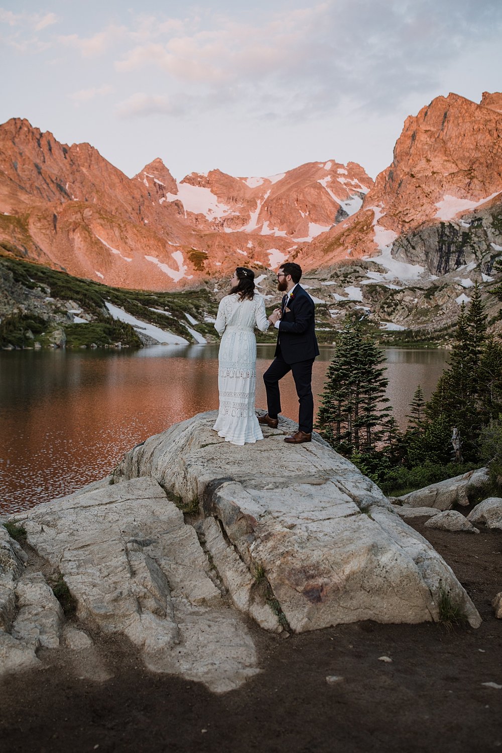 couple saying their wedding vows, shoshoni peak alpenglow, sunrise over lake isabelle, mountainside elopement ceremony, front range alpenglow