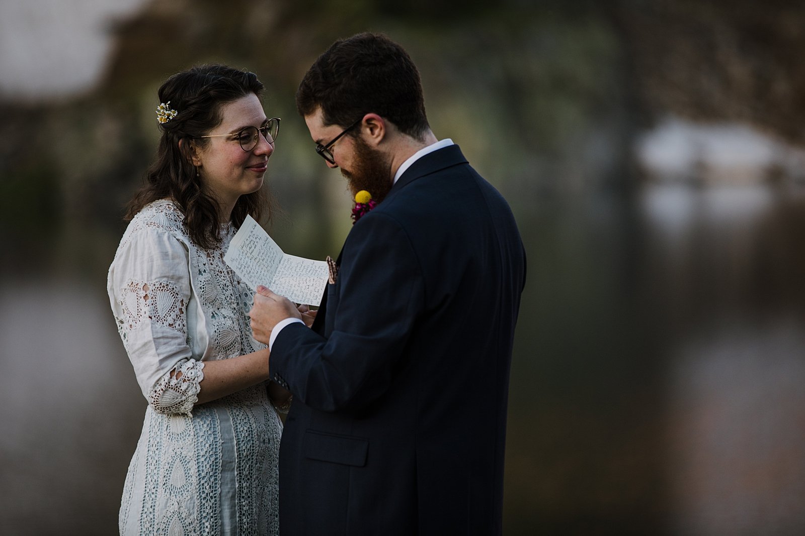 groom sharing his wedding vows, alpenglow reflection on alpine lake, self solemnizing in colorado, self solemnizing ceremony, snow laiden peaks, pine forest elopement