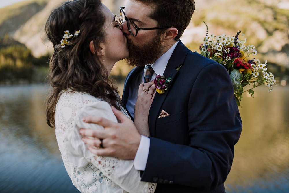 couple kissing, eloping above tree line, post vow celebration, post vow exploring, honeymoon roadtrip, western states roadtrip, budget wedding dress, budget elopement, high alpine backcountry trails