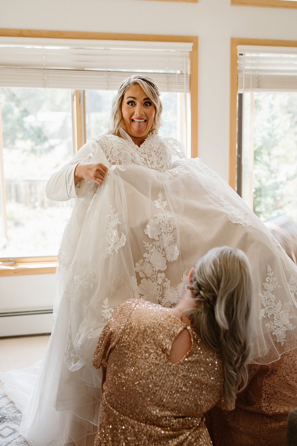 bride stepping into wedding dress, bride putting on wedding dress, breckenridge colorado wedding, breckenridge summer wedding, mountain wedding, summit county wedding, breckenridge airbnb wedding