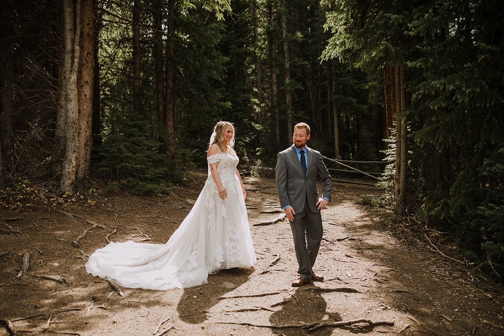 groom turns for first look, breckenridge mountain wedding, breckenridge nordic center wedding, breckenridge hiking wedding, breckridge trail wedding, summit county colorado wedding, peak 8 wedding