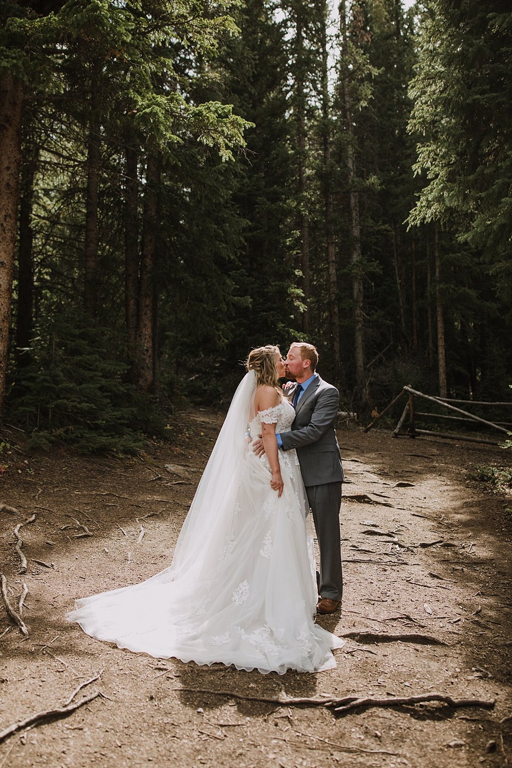 bride and groom kiss after first look, breckenridge mountain wedding, breckenridge nordic center wedding, breckenridge hiking wedding, breckridge trail wedding, summit county colorado wedding