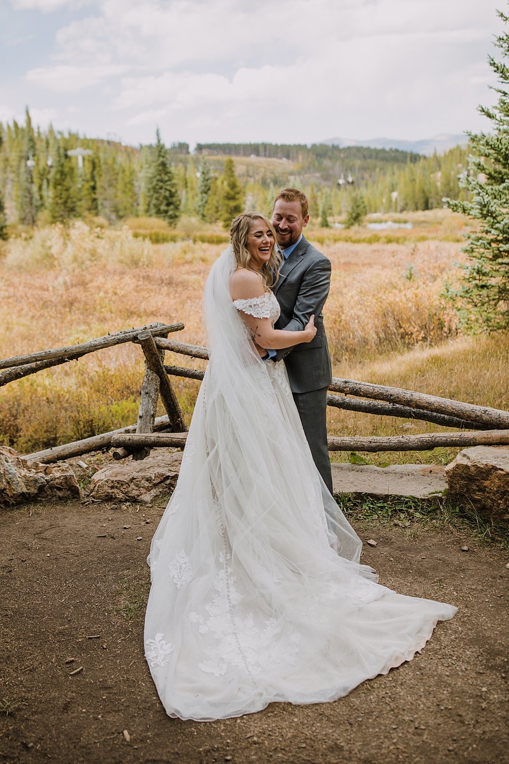 bride and groom hugging in fall colors, breckenridge autumn leaves, aspen leaves changing, fall aspen wedding, colorado aspen leaves, colorado fall wedding, summit county fall colors