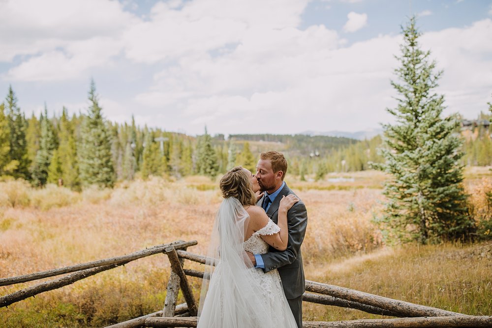 bride and groom hugging by cucumber gulch, breckenridge autumn leaves, aspen leaves changing, fall aspen wedding, colorado aspen leaves, colorado fall wedding, summit county fall colors