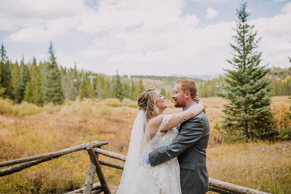 bride and groom hugging by cucumber gulch, breckenridge autumn leaves, aspen leaves changing, fall aspen wedding, colorado aspen leaves, colorado fall wedding, summit county fall colors