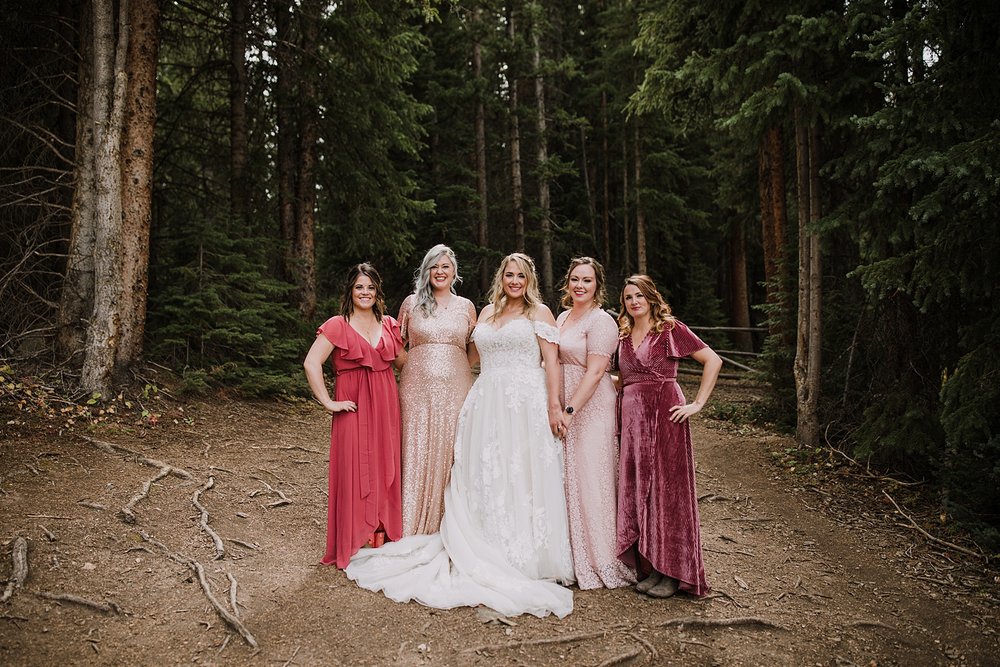 bridesmaids standing together, breckenridge nordic center wedding, breckenridge ski mountain wedding, carter park pavilion wedding, summit county colorado wedding, fall wedding in breckenridge