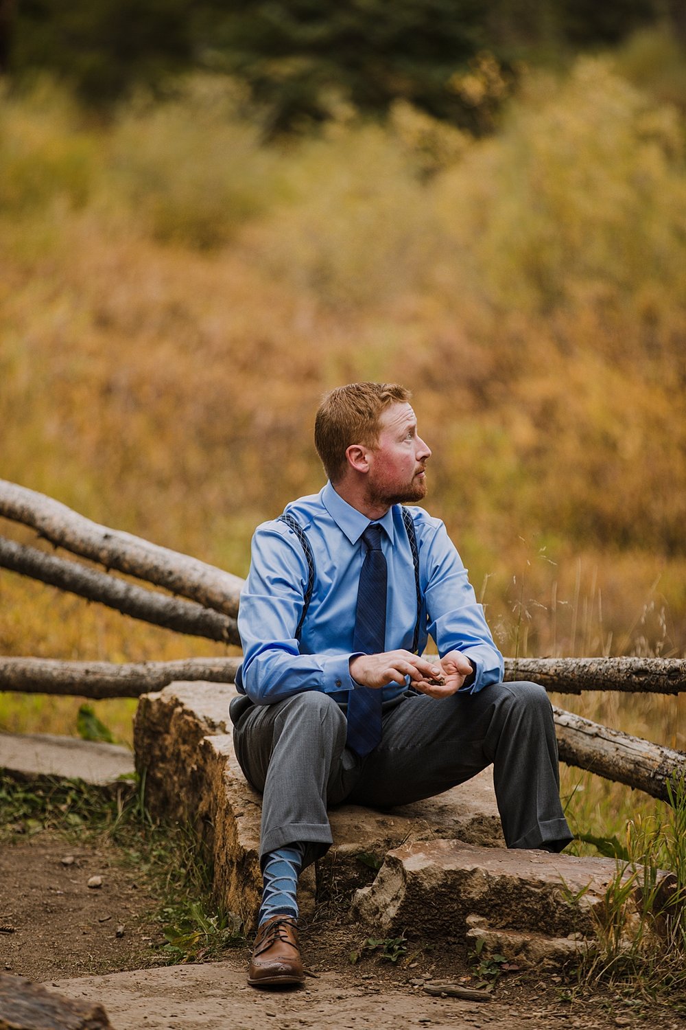 groom sitting by cucumber gulch, breckenridge autumn leaves, aspen leaves changing, fall aspen wedding, colorado aspen leaves, colorado fall wedding, summit county fall colors