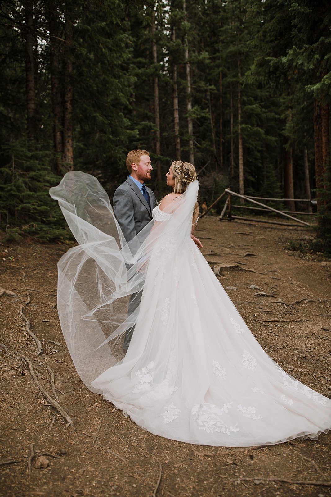 bride and groom walking in a the woods, breckenridge forest wedding, colorado wooded wedding, breckenridge nordic center hiking trails, breckenridge hiking elopement