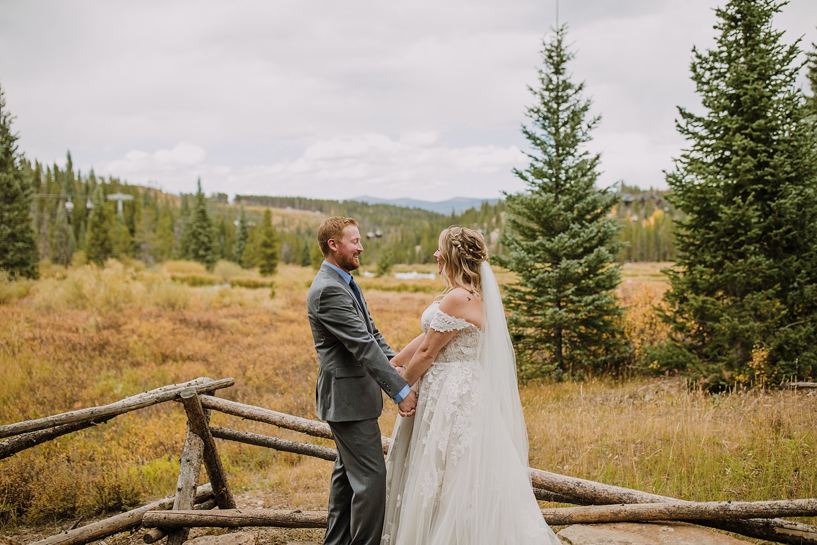 bride and groom walking in a the woods, breckenridge forest wedding, colorado wooded wedding, breckenridge nordic center hiking trails, breckenridge fall hiking elopement