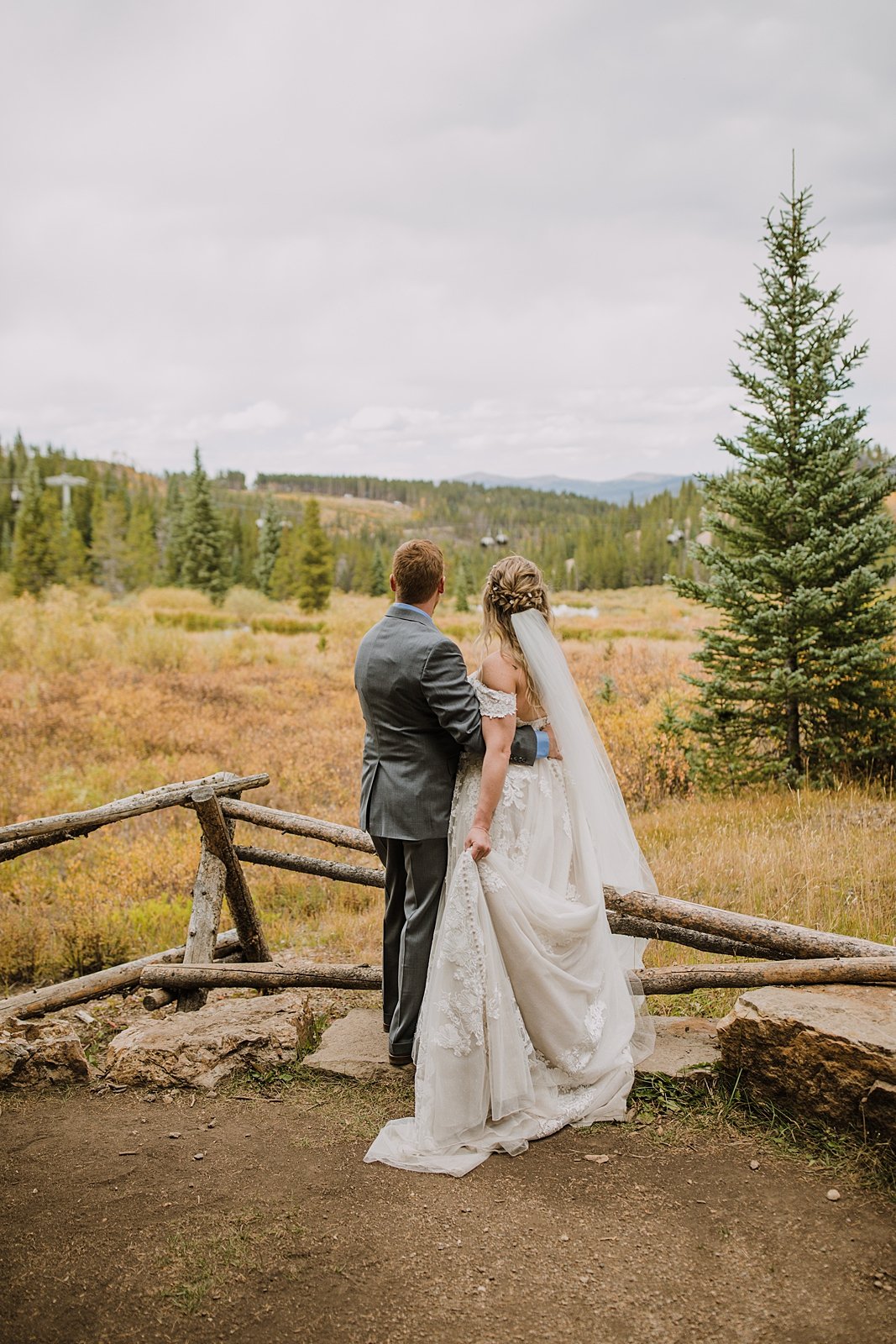 bride and groom looking at the mountains, breckenridge forest wedding, colorado wooded wedding, breckenridge nordic center hiking trails, breckenridge fall hiking elopement