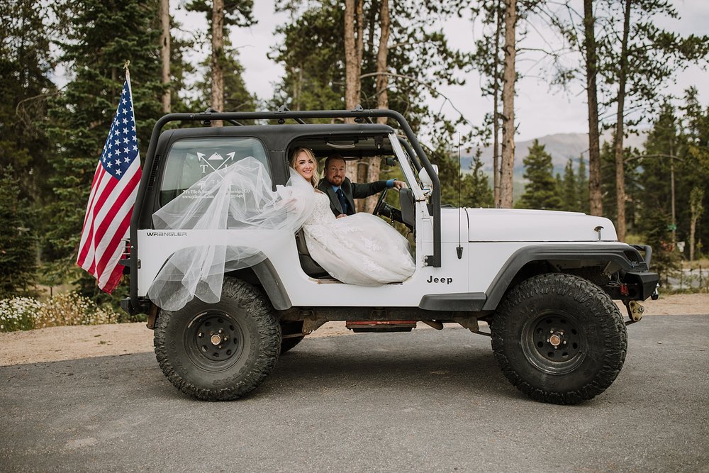 bride and groom riding in jeep, colorado jeep wedding, off roading wedding day, breckenridge jeep wedding, colorado conservative, breckenridge overlook wedding, st. johns pass jeep trail 