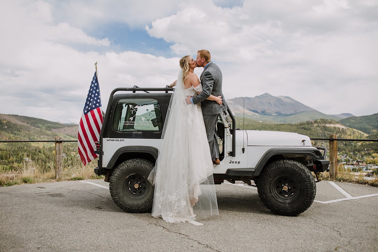 bride and groom kissing on top of jeep, colorado jeep wedding, off roading wedding day, breckenridge jeep wedding, colorado conservative, breckenridge overlook wedding, st. johns pass jeep trail 