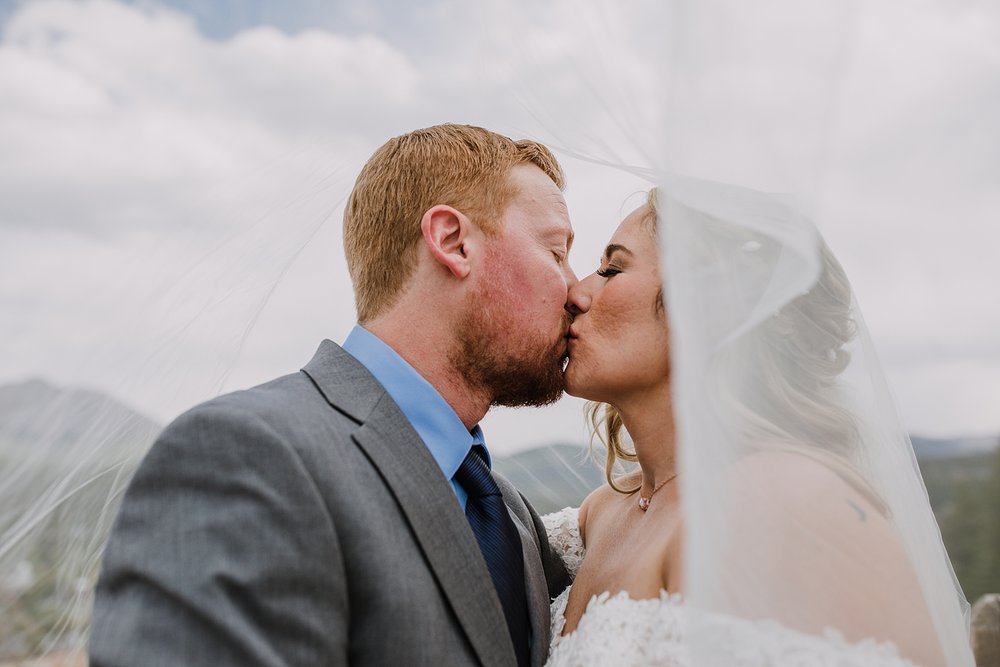 bride and groom kissing at breckenridge overlook, mt. baldy colorado wedding, baldy mountain wedding in breckenridge colorado, september wedding in colorado, breckenridge summer wedding