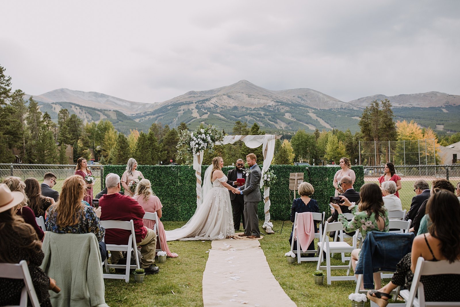 bride and groom standing together during ceremony, breckenridge colorado fall wedding, carter park pavilion fall wedding, intimate wedding reception at carter park pavilion in breckenridge